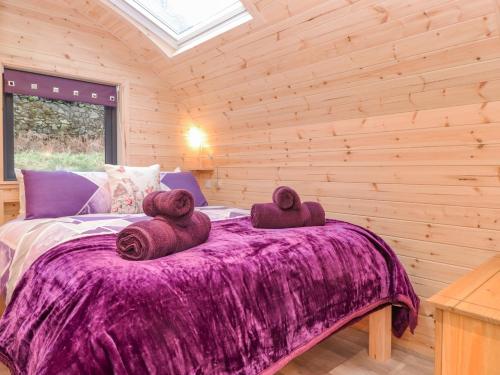 a bedroom with a bed with two teddy bears on it at Lovies Place - Crossgate Luxury Glamping in Penrith