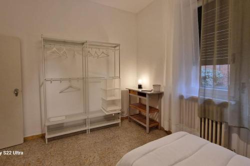 a bedroom with a bed and a desk and a window at Come a casa in Tognazza