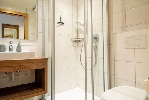 a bathroom with a shower and a sink at Marlis Apartments in Ischgl