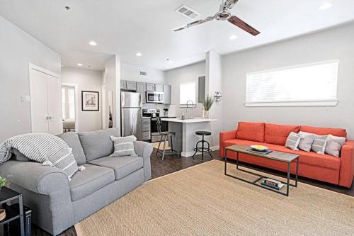 a living room with a couch and a table at Global Cup The Kozy Urban Dallas Flat in Dallas