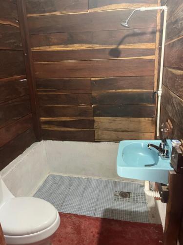 a bathroom with a toilet and a sink at CASADOS RANCH in Escárcega