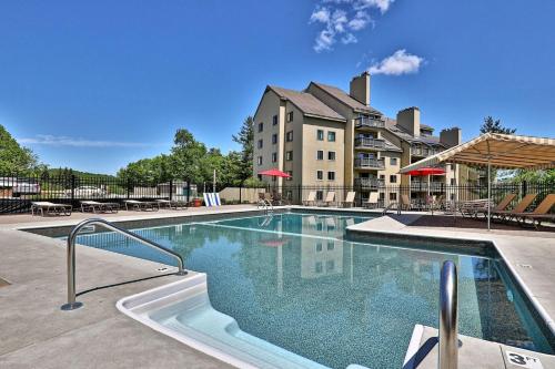 a large swimming pool in front of a building at Mountain Green Resort by Killington VR - 2 Bedrooms in Killington