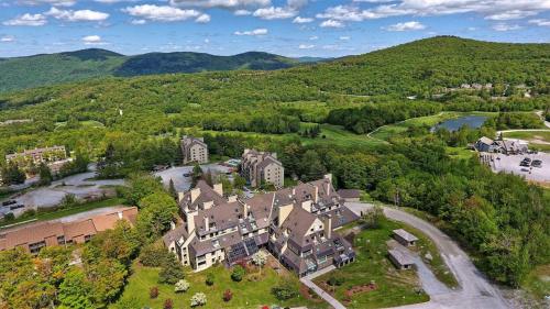 an aerial view of a mansion in the mountains at Mountain Green Resort by Killington VR - 2 Bedrooms in Killington