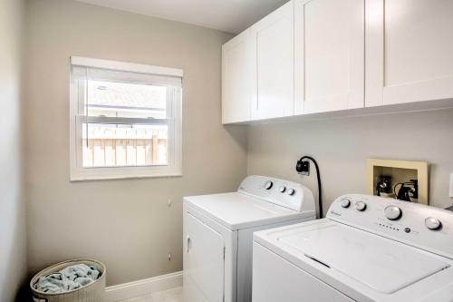 a white laundry room with a washer and dryer at Naples Home with Lanai and Pool Near Vanderbilt Beach! in Naples