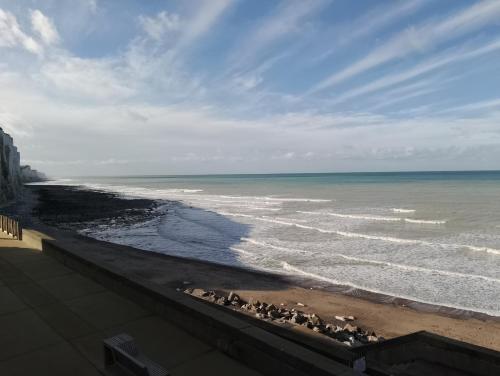 a view of the ocean from a balcony at Le Rayon Vert in Ault