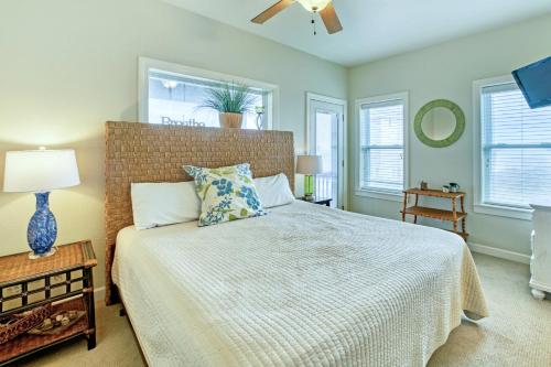 a bedroom with a bed and a ceiling fan at Gone Coastal 139 in Rodanthe