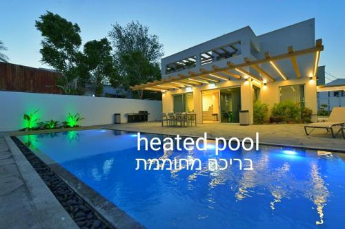 a villa with a heated pool in antipolis at Shani House Of Style SEATARA VILLA in Eilat