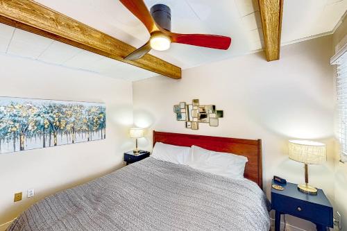 a bedroom with a bed with a ceiling fan at Big Sky Dreamin in Big Sky