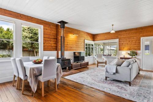 a dining room with a table and chairs at 'Balmoral Cottage' A Kingston Beach Escape in Kingston Beach