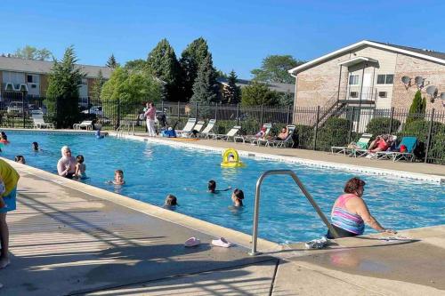 a group of people in a swimming pool at Lg. 2 br Apt. North of Chicago w/ Free Parking in Des Plaines