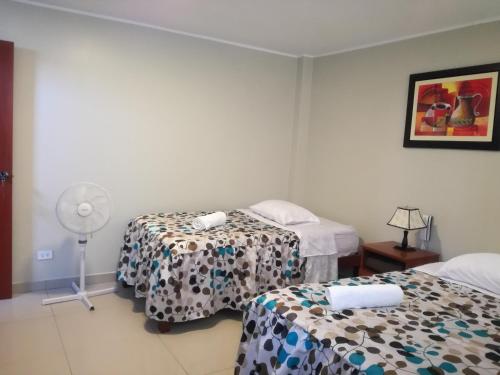 Voodi või voodid majutusasutuse PiscoMar Peru toas