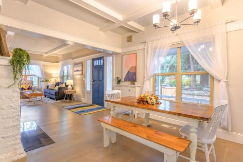 a dining room with a table and a living room at Upgraded Home with 5 BR 4 Bath 4 FREE gated parking space, Family,EV,RV friendly in Seattle