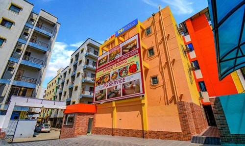 a building with a sign on the side of it at FabHotel Empire Executive - Nr HINJEWADI PHASE 1 in Pune