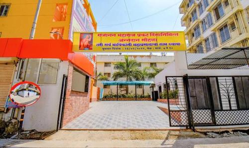 a building with a gate in front of a building at FabHotel Empire Executive - Nr HINJEWADI PHASE 1 in Pune