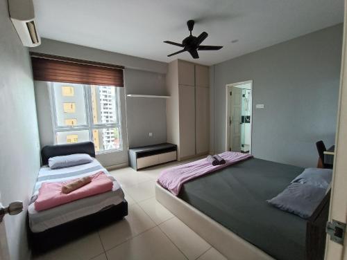a bedroom with two beds and a ceiling fan at Mansion One, Private Room in George Town