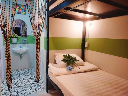 Postel nebo postele na pokoji v ubytování Ben Guesthouse Phu Quoc