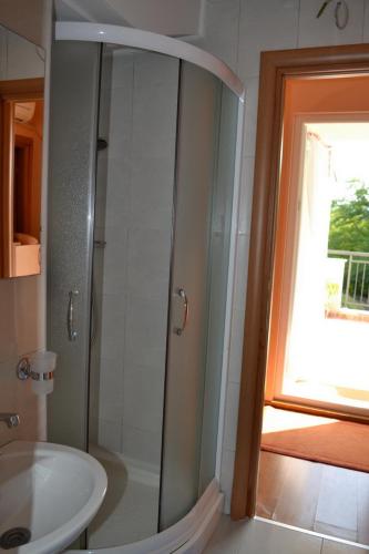 a bathroom with a shower and a sink at Apartmani Stipanic Tivat in Tivat