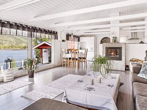 a living room with a couch and a table in it at 9 person holiday home in Mosvik-By Traum in Mosvik
