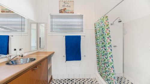 a bathroom with a sink and a shower at 92 Landsborough Parade Golden Beach in Golden Beach