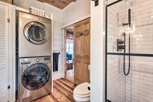 a washer and dryer in a bathroom with a shower at Charming Bristol Cottage with Private Beach! in Bristol