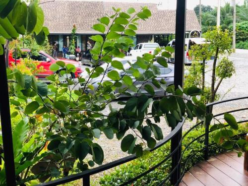 a view of a parking lot with cars at กอบสุข รีสอร์ท2 k04 in Ban Ton Liang