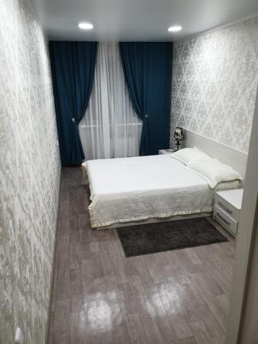 Ένα ή περισσότερα κρεβάτια σε δωμάτιο στο Apartment on Metallurgov 32
