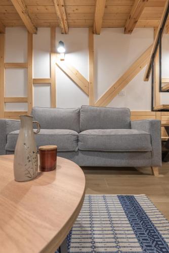 a living room with a couch and a table at Mila house Tara in Bajina Bašta