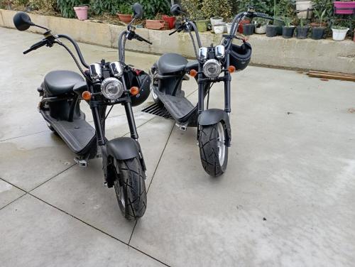 two motorcycles parked next to each other on a sidewalk at Apartamentos Herri Ondo REFUGIO CLIMATICO in Iturmendi