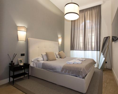 Llit o llits en una habitació de N A P Experience Apartments