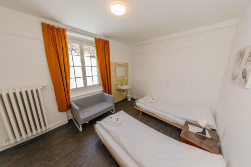 Postel nebo postele na pokoji v ubytování Zentrum Haus Davos