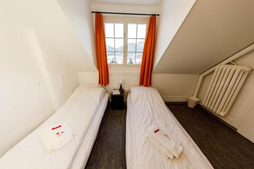 Postel nebo postele na pokoji v ubytování Zentrum Haus Davos