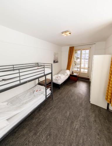 Postel nebo postele na pokoji v ubytování Zentrum Haus Davos