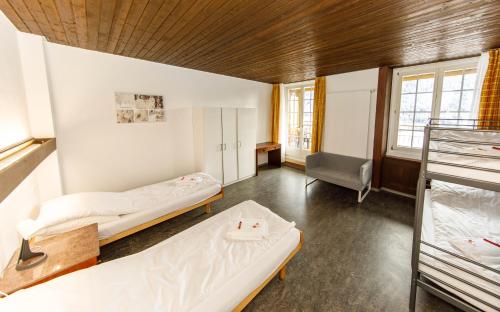 Postel nebo postele na pokoji v ubytování Zentrum Haus Davos