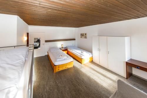 Postel nebo postele na pokoji v ubytování Zentrum Haus Davos