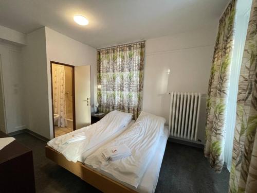 Postel nebo postele na pokoji v ubytování Zentrum Haus Davos
