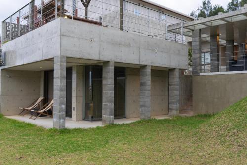 a building with columns on the side of it at -Musée Villa- in Nakijin