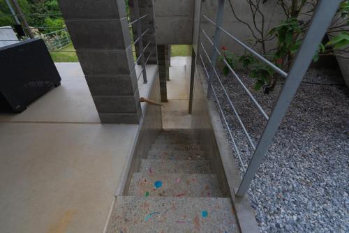 a set of stairs leading up to a house at -Musée Villa- in Nakijin