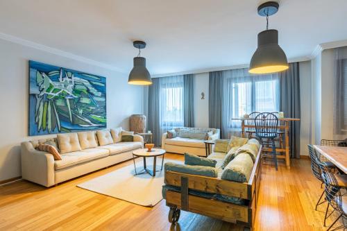 a living room with a couch and a table at Delightful Flat with Bosphorus View in Kuzguncuk in Istanbul