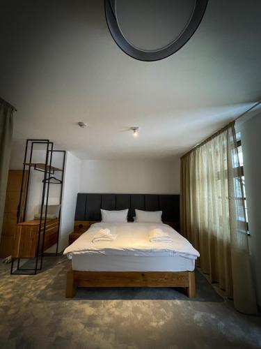 a bedroom with a bed and a round ceiling at DOMA u nás Boutique hotel & spa in Poprad