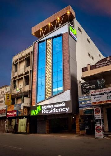 a building with lights on top of it on a street at IVY RESIDENCY in Coimbatore