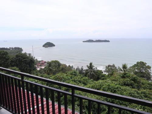 a view of the ocean from the balcony of a resort at The view padang, Amazing view, 8 mins Mentawai fast ferry, cold beer,close to restaurants in Padang