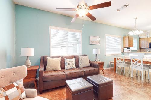 a living room with a couch and a dining room at Lyla's Beach Getaway in Padre Island