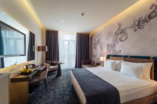 Postel nebo postele na pokoji v ubytování IC Hotels Airport