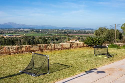 two soccer nets sitting on top of a field at Sa Figuereta Living Place in Ariany