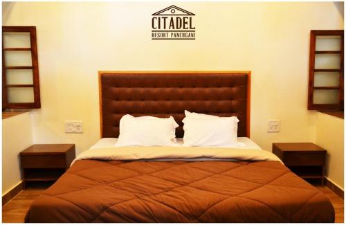 Tempat tidur dalam kamar di Citadel Resort