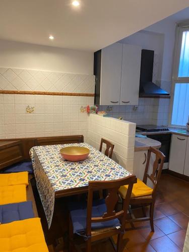 a kitchen with a table with a bowl on it at VHOMETREVI in Rome