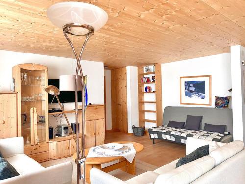 a living room with a couch and a table at Hotel Ducan in Monstein