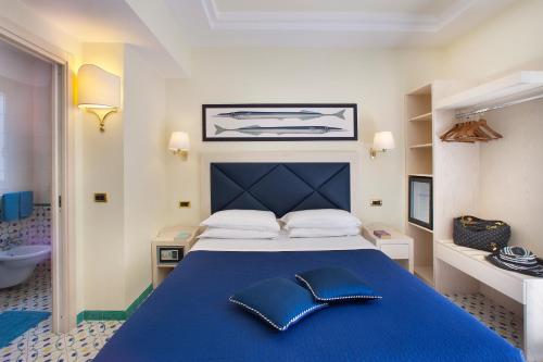 Postel nebo postele na pokoji v ubytování Hotel Del Mare