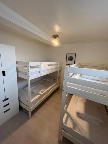 a room with two bunk beds in it at Nice Apartment close to everything in Malmö