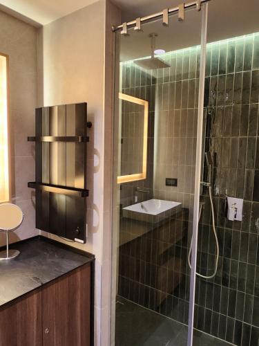 a bathroom with a shower and a sink at Kopaonik Woodside in Kopaonik